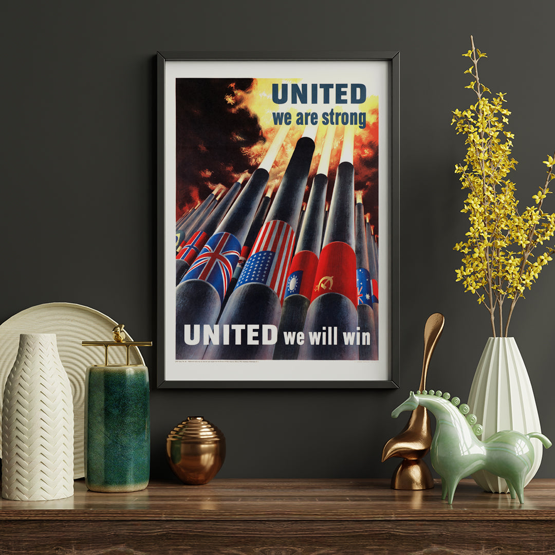 Allied nation flags on artillery cannons in fiery sky with text United we are strong United we will win by Henry Koerner, framed and displayed in home decor