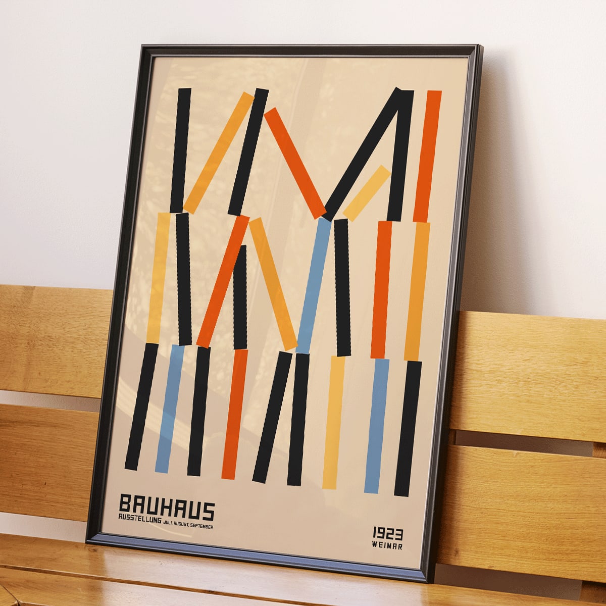 Bauhaus Poster 6 by designer with abstract geometric vertical lines in black orange and blue on beige background inspired by Weimar Exhibition, framed and displayed in modern living room decor