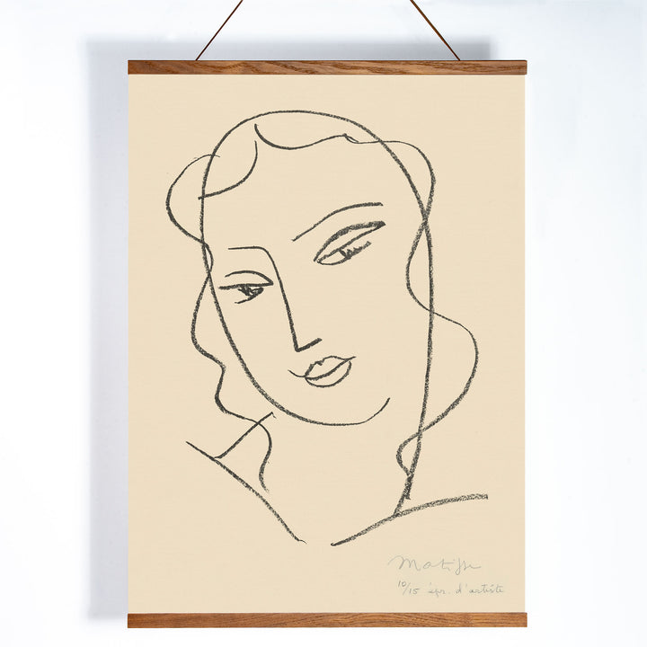 Henri Matisse Veiled Head poster with minimalist veiled face in black linework on a warm pale background, with wooden magnetic frame on white background