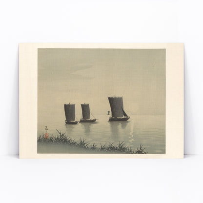 Serene Japanese art of three traditional fishing boats on calm water at sunset by Ohara Koson, framed and displayed in modern living room decor