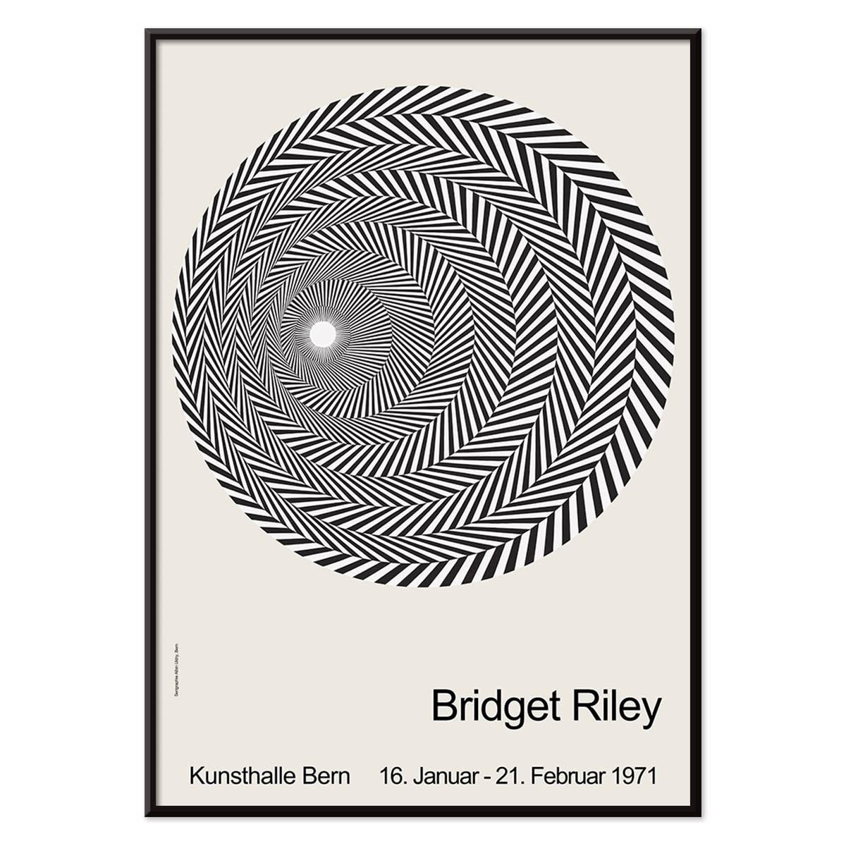 Bridget Riley Blaze Exhibition Poster featuring hypnotic black and white spiral geometric design on light background, with black aluminium frame on white background