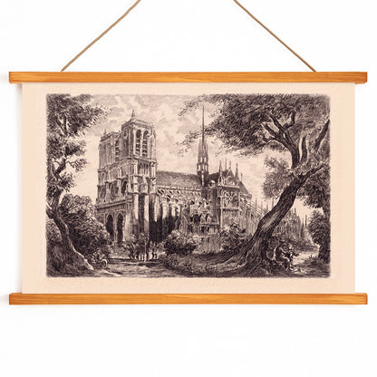 Artistic poster of Notre Dame de Paris cathedral surrounded by trees and people in a scenic landscape, with wooden magnetic frame on white background