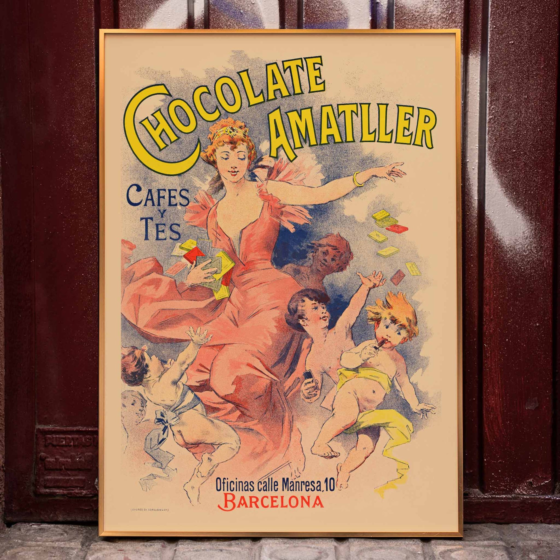 Anonymous Chocolate Amatller poster with dancing woman and children, bold yellow lettering, warm pastel tones, framed and displayed in home decor