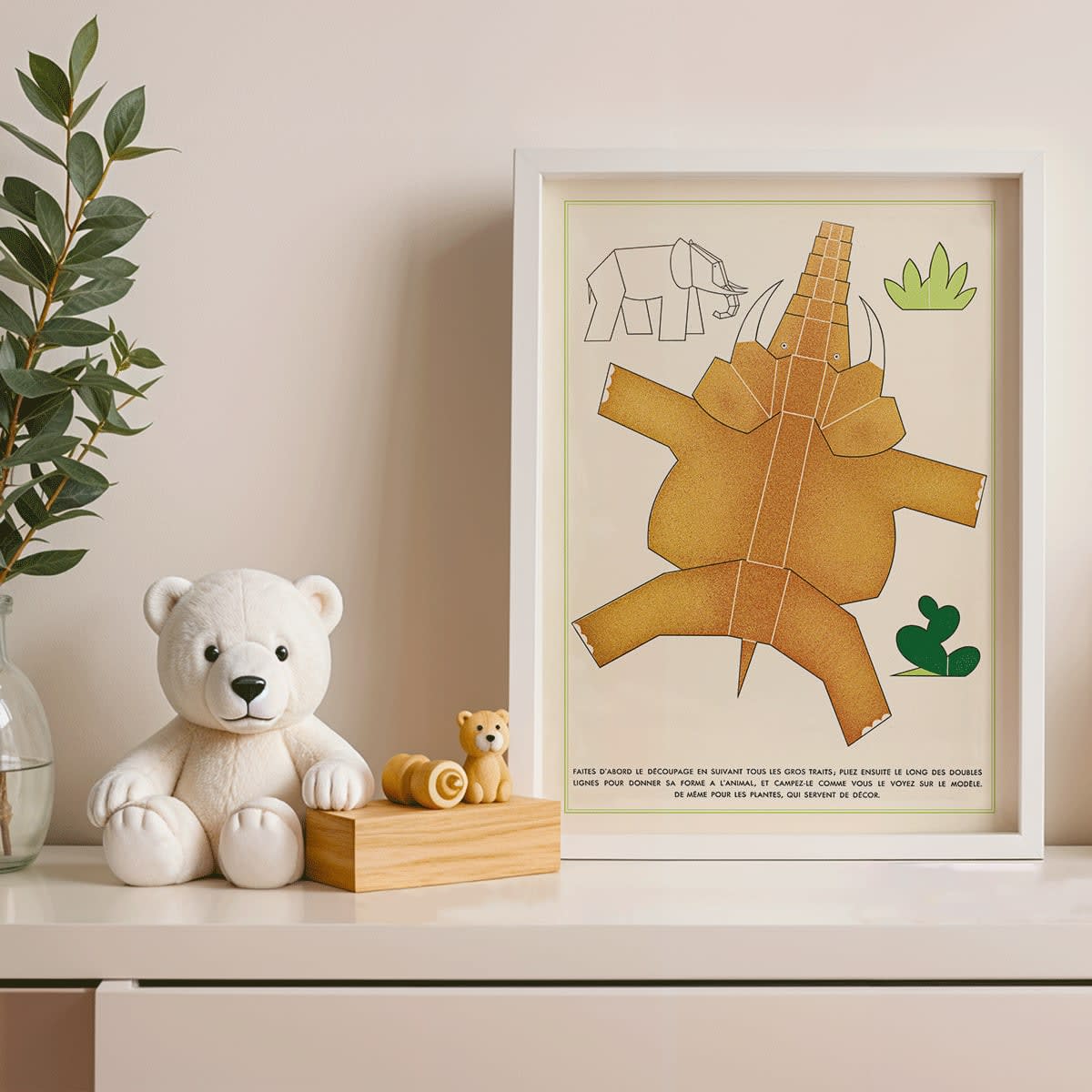 Collage and poster of geometric cutout animals and plants by Turenne Chevallereau La Jungle chez moi Pl 02, framed and displayed in modern living room decor