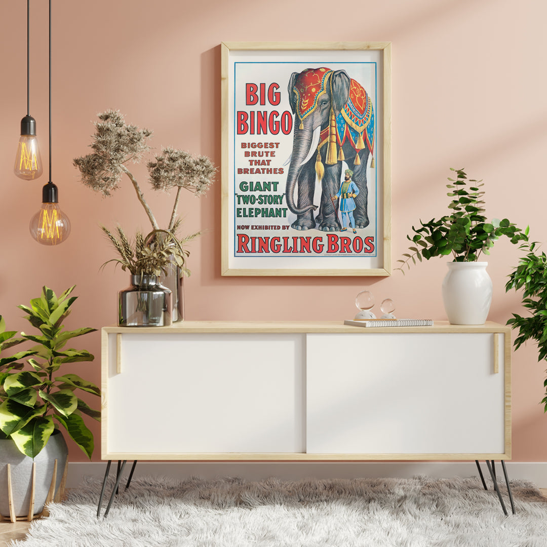 Colorful circus elephant and trainer poster artwork featuring Big Bingo a decorated giant elephant and circus keeper with vibrant circus themed graphics, framed and displayed in home decor