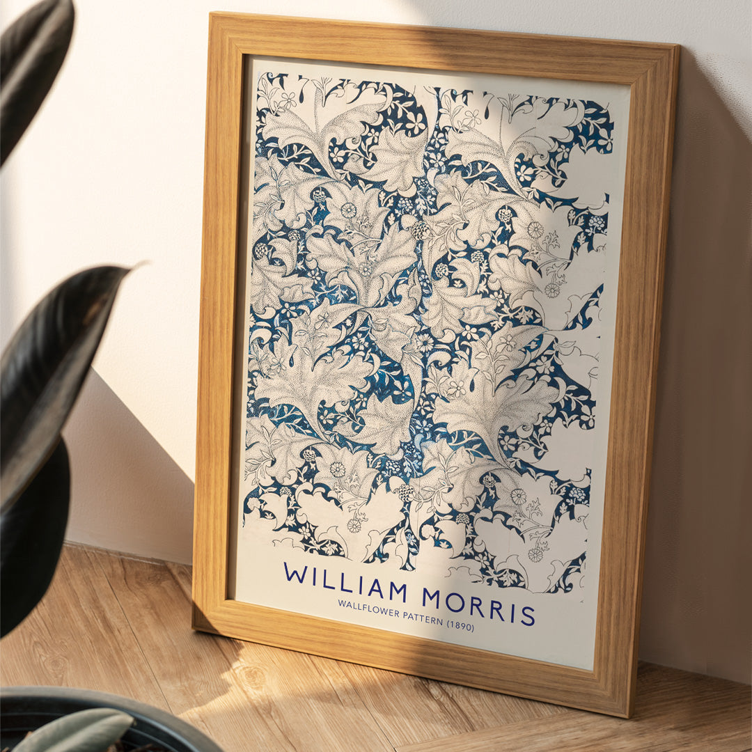 Wallflower Pattern by William Morris featuring intricate blue and white floral botanical design with decorative leaves artwork poster, framed and displayed in home decor