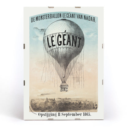 Hot air balloon Le Géant by Nadar Morriën and Amand flying above a cityscape poster titled The Monster Balloon, framed and displayed in modern living room decor