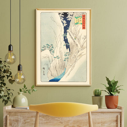 Snowy mountain gorge with river travelers and trees in The Kiso Gorge in Snow Shinano Province by Hiroshige II Japanese artwork poster, framed and displayed in home decor