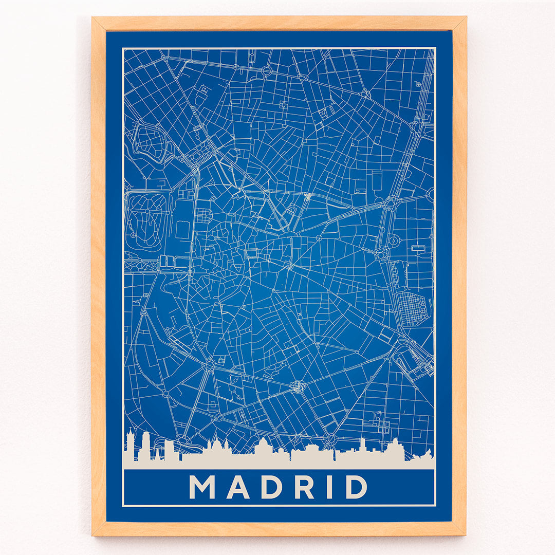 Minimalist Madrid Map by Artist Name blue and white city layout with silhouettes and street details poster, framed and displayed in modern living room decor