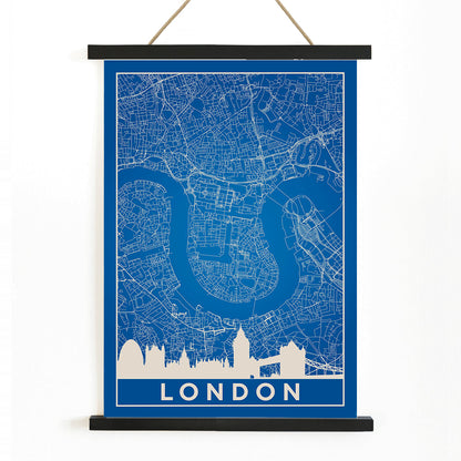 Minimalist London map artwork poster with blue background white map details by artist Anonymous featuring major landmarks, with wooden magnetic frame on white background