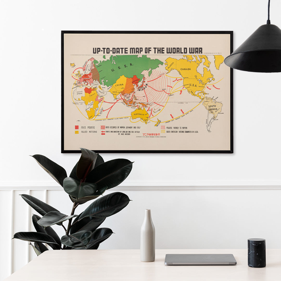 Colorful illustrated world war map showing Axis and Allied powers and marked war zones by Manila Shinbun-sha up-to-date map of the world war, framed and displayed in home decor