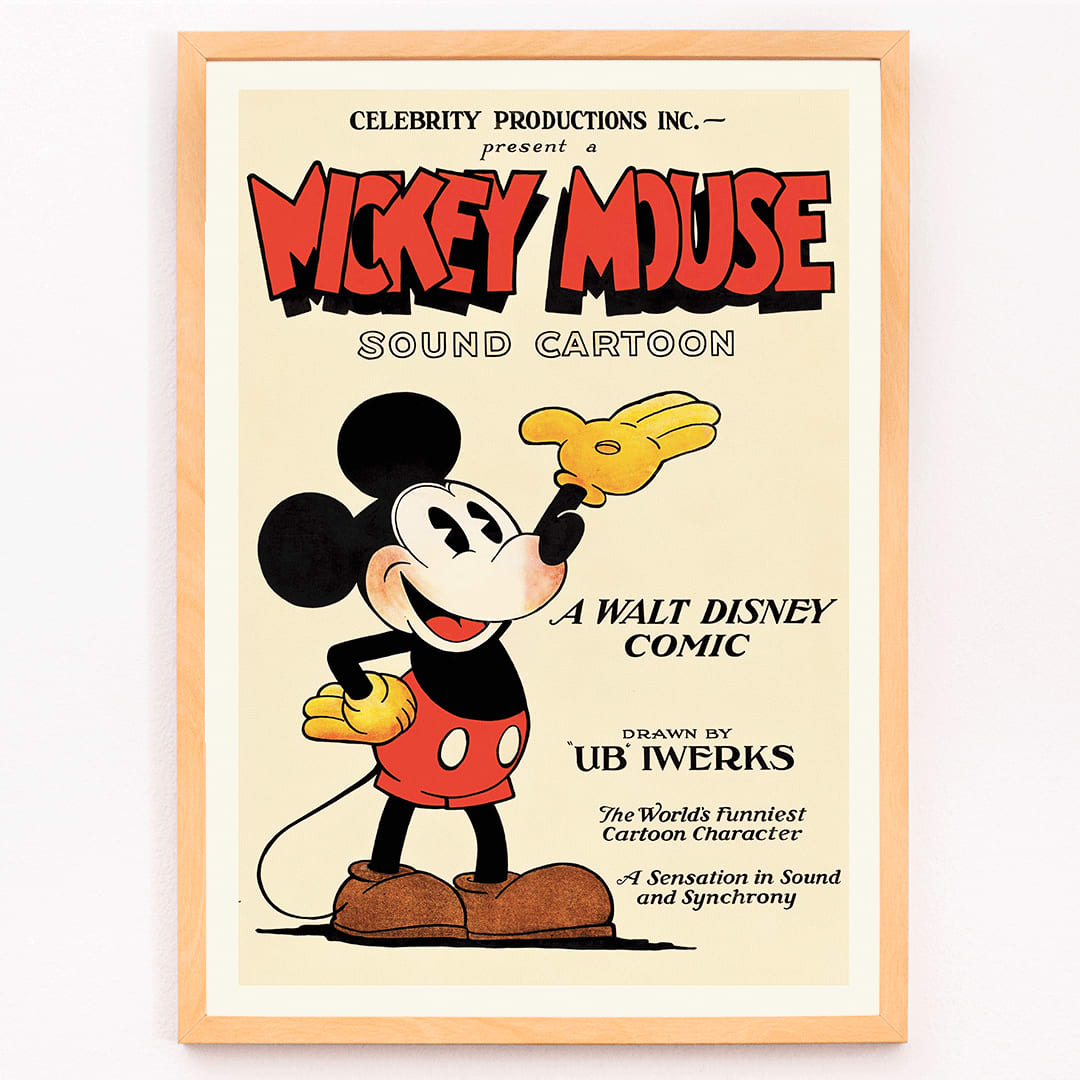 Mickey Mouse poster by Ub Iwerks and Walt Disney featuring Sound Cartoon comic artwork with Mickey smiling in yellow gloves and red shorts, framed and displayed in modern living room decor
