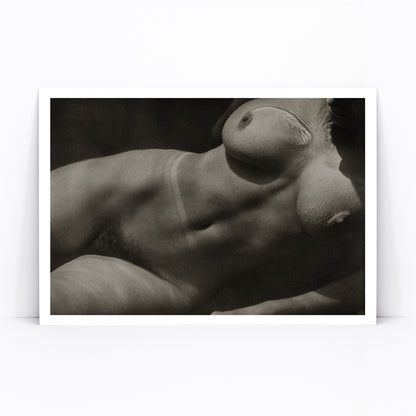 Black and white artistic photograph of reclining nude female torso Rebecca Salsbury Strand by Alfred Stieglitz, framed and displayed in modern living room decor