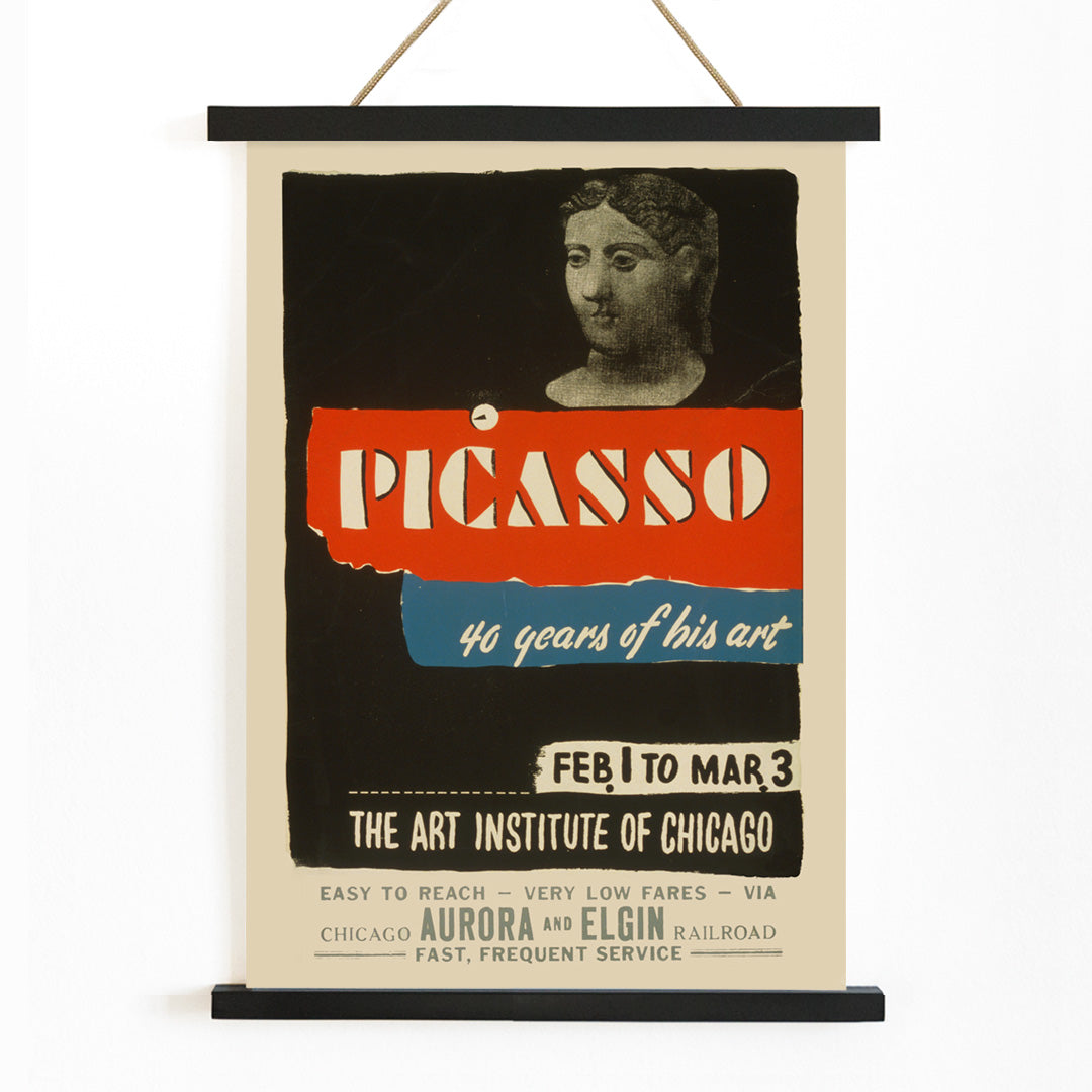 Vintage exhibition poster for Picasso 40 years of his art at Art Institute of Chicago featuring classical sculpture bold graphic text and sculpted head artwork, with wooden magnetic frame on white background