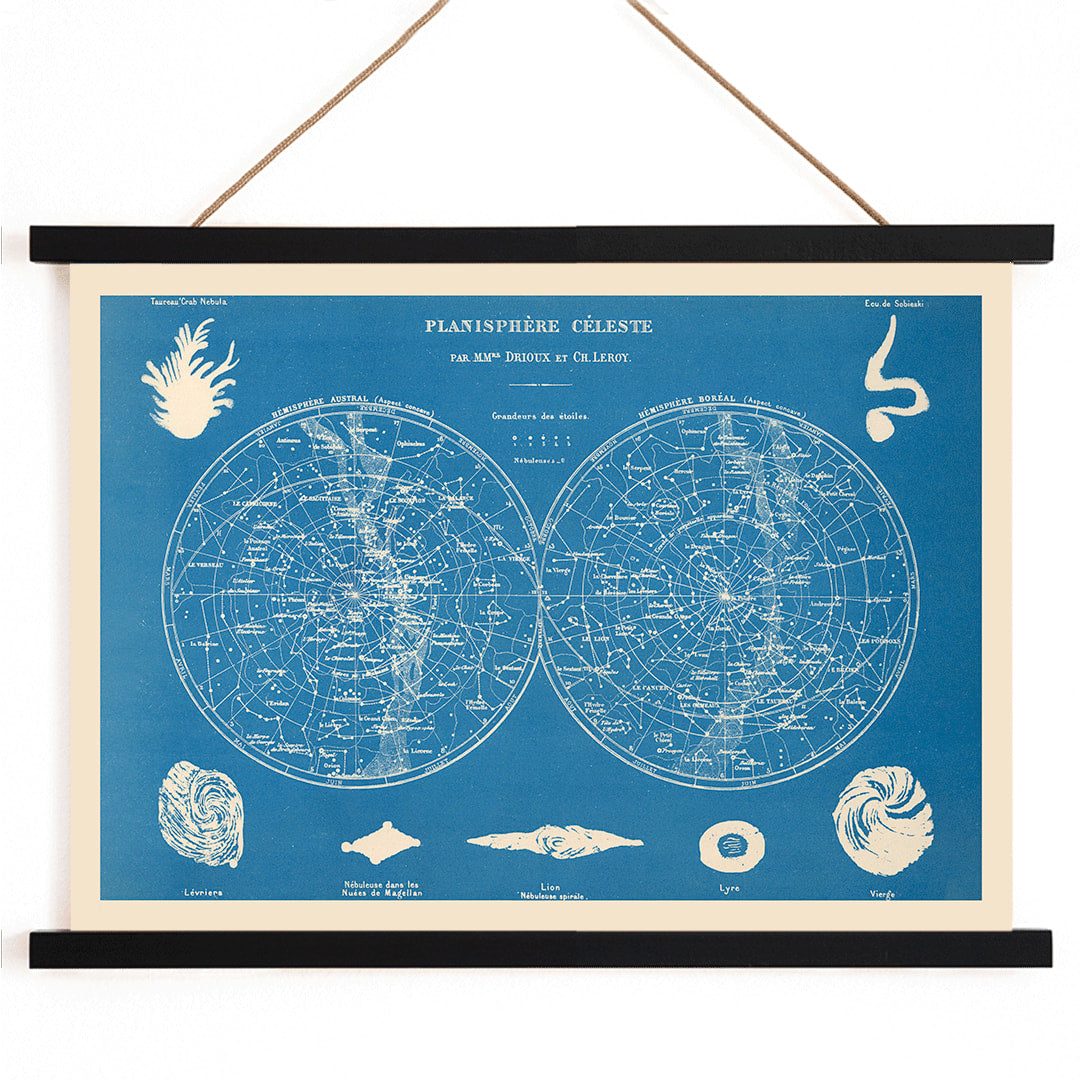 Celestial planisphere star map poster by Claude Joseph Drioux featuring constellations and astronomical illustrations on blue background, with wooden magnetic frame on white background