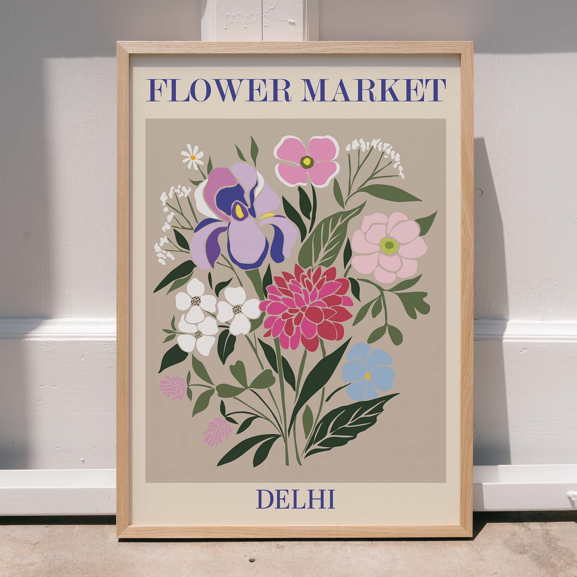 Colorful floral illustration and poster of a vibrant flower arrangement titled Flower Market Delhi by Moryarty, framed and displayed in home decor