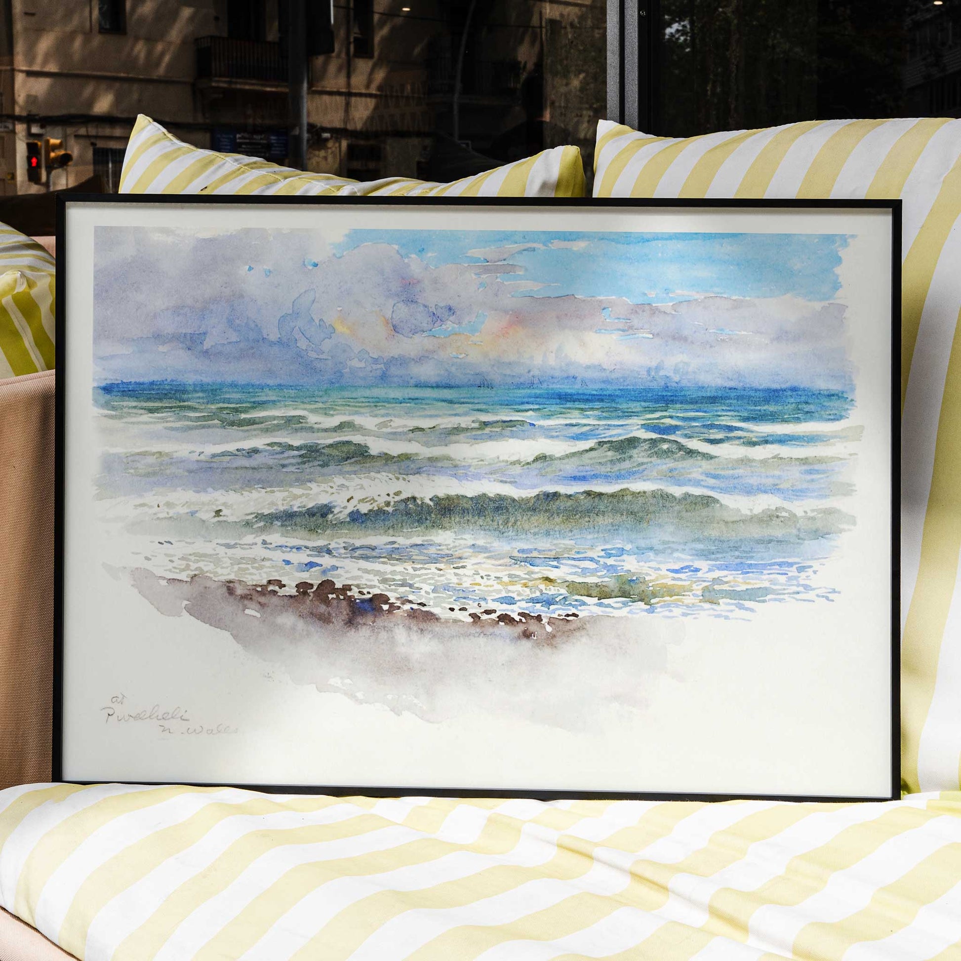 Seascape painting and seaside landscape with waves at Pwllheli North Wales by George Elbert Burr on a poster showing clouds, framed and displayed in home decor