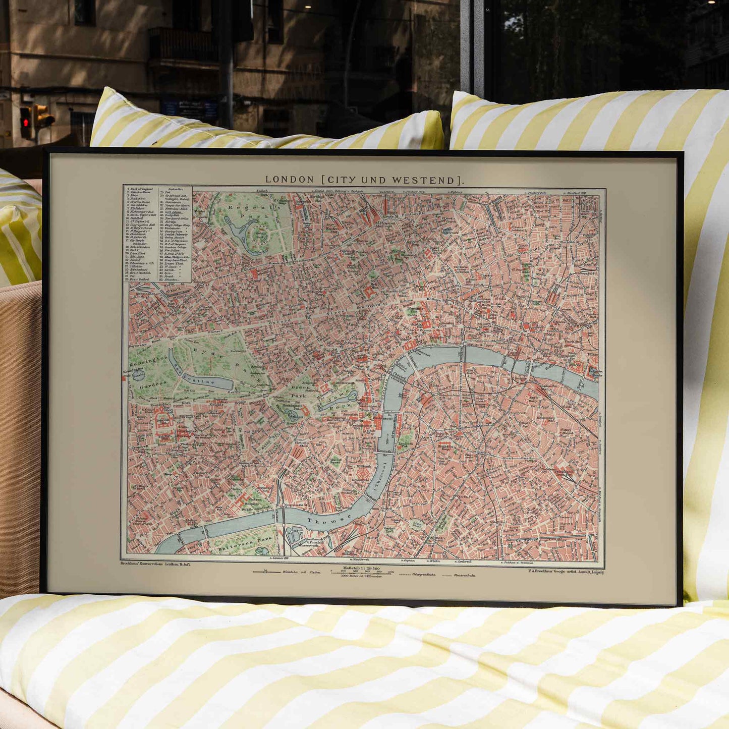 Ancient map of London by Bibliographic institute of Liepzig showing detailed vintage city streets river Thames and parks, framed and displayed in home decor