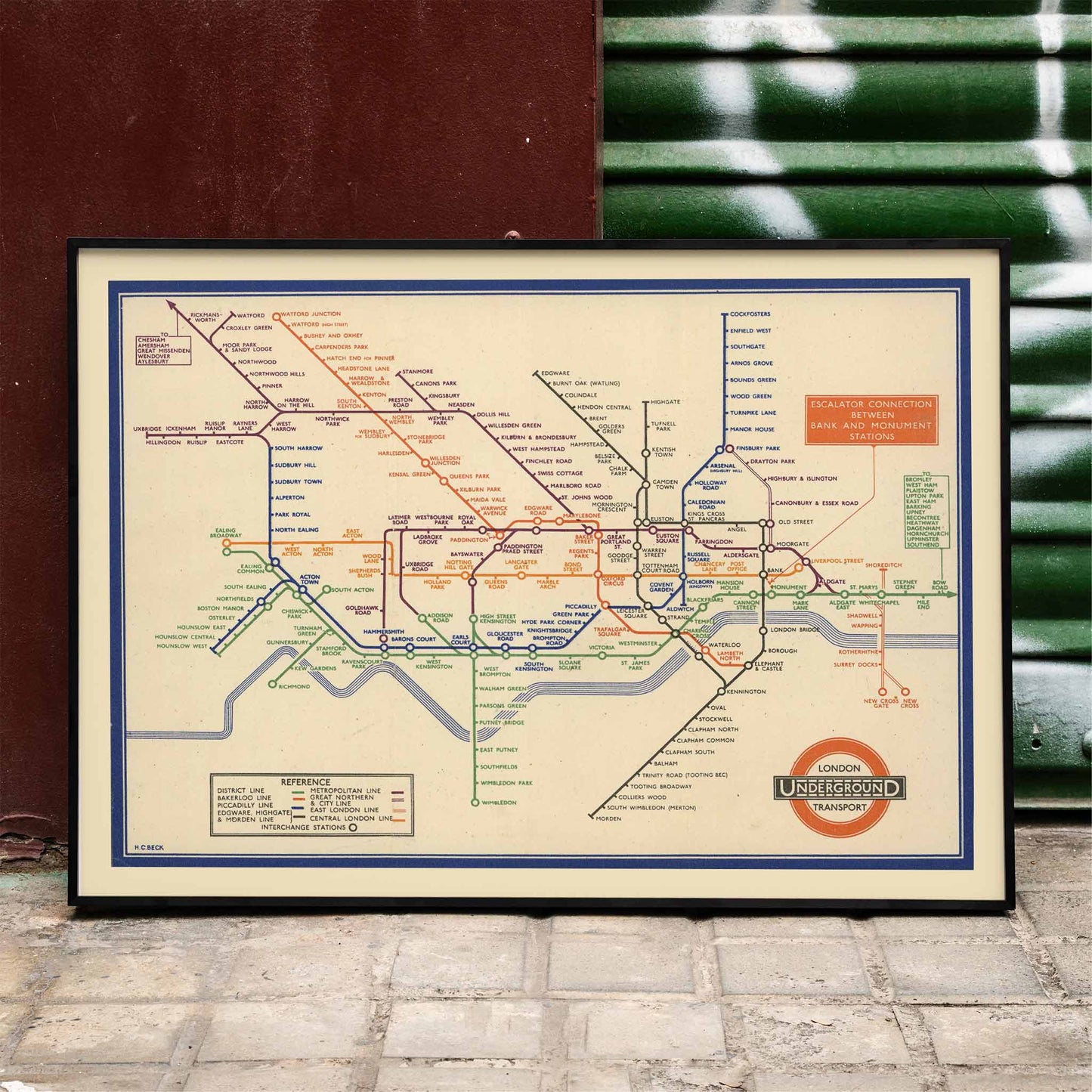 Vintage London Underground map artwork by London Transport featuring colorful lines and station names in a classic design, framed and displayed in home decor