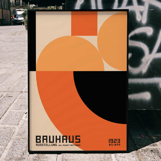 Bauhaus Poster 4 inspired by the Weimar Exhibition featuring abstract geometric shapes in orange and black by unknown artist, framed and displayed in home decor