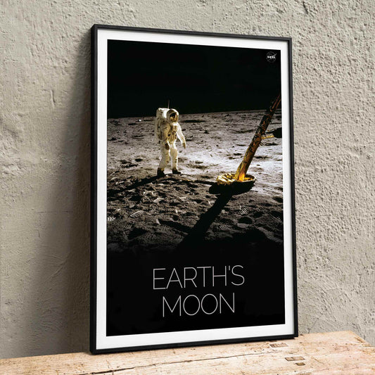 Astronaut on the lunar surface with text Earths Moon Man on Moon 2 by NASA poster, framed and displayed in home decor