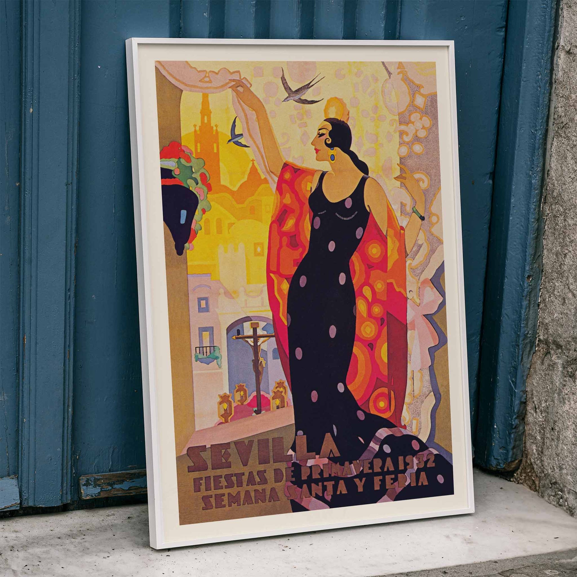 Sevilla Fiestas de primavera poster by Balaca y Orejas-Canseco featuring a colorful flamenco dancer in a vibrant dress with cityscape and birds in the background, framed and displayed in home decor
