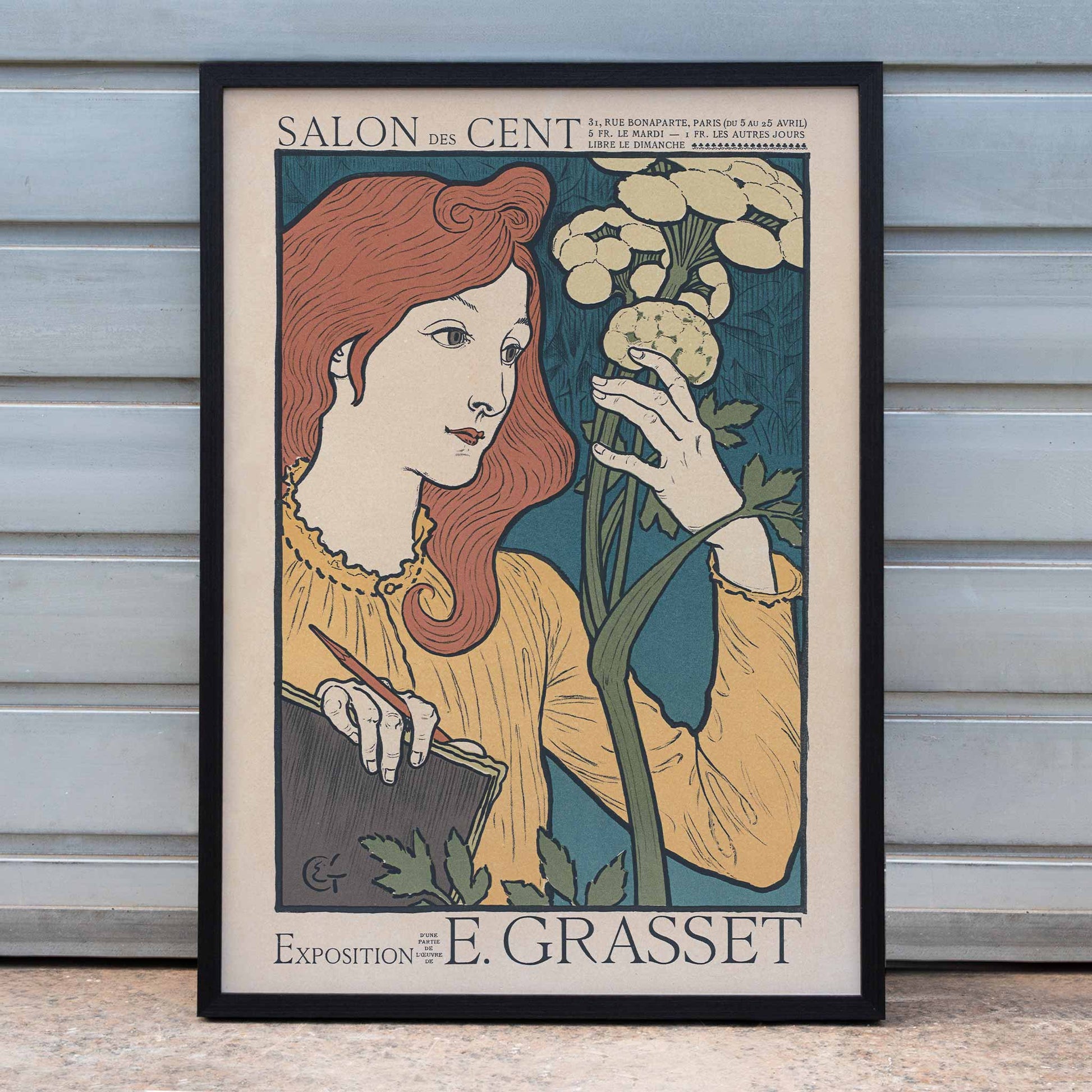 Eugène Grasset Salon des Cent poster featuring a red haired woman with flowers in cream teal and yellow Art Nouveau style, framed and displayed in home decor