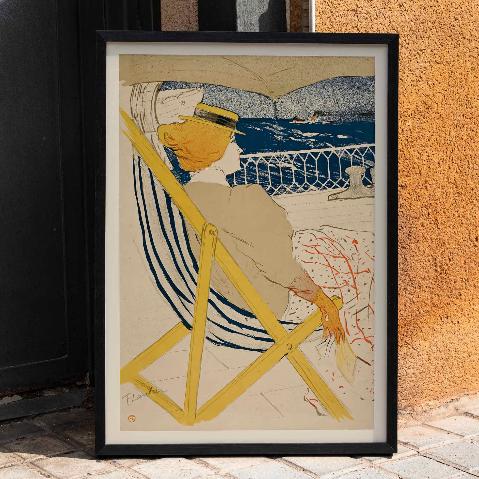 Henri de Toulouse-Lautrec La passagère du 54 poster with seated woman on deck blue sea striped chair and yellow accents, framed and displayed in home decor