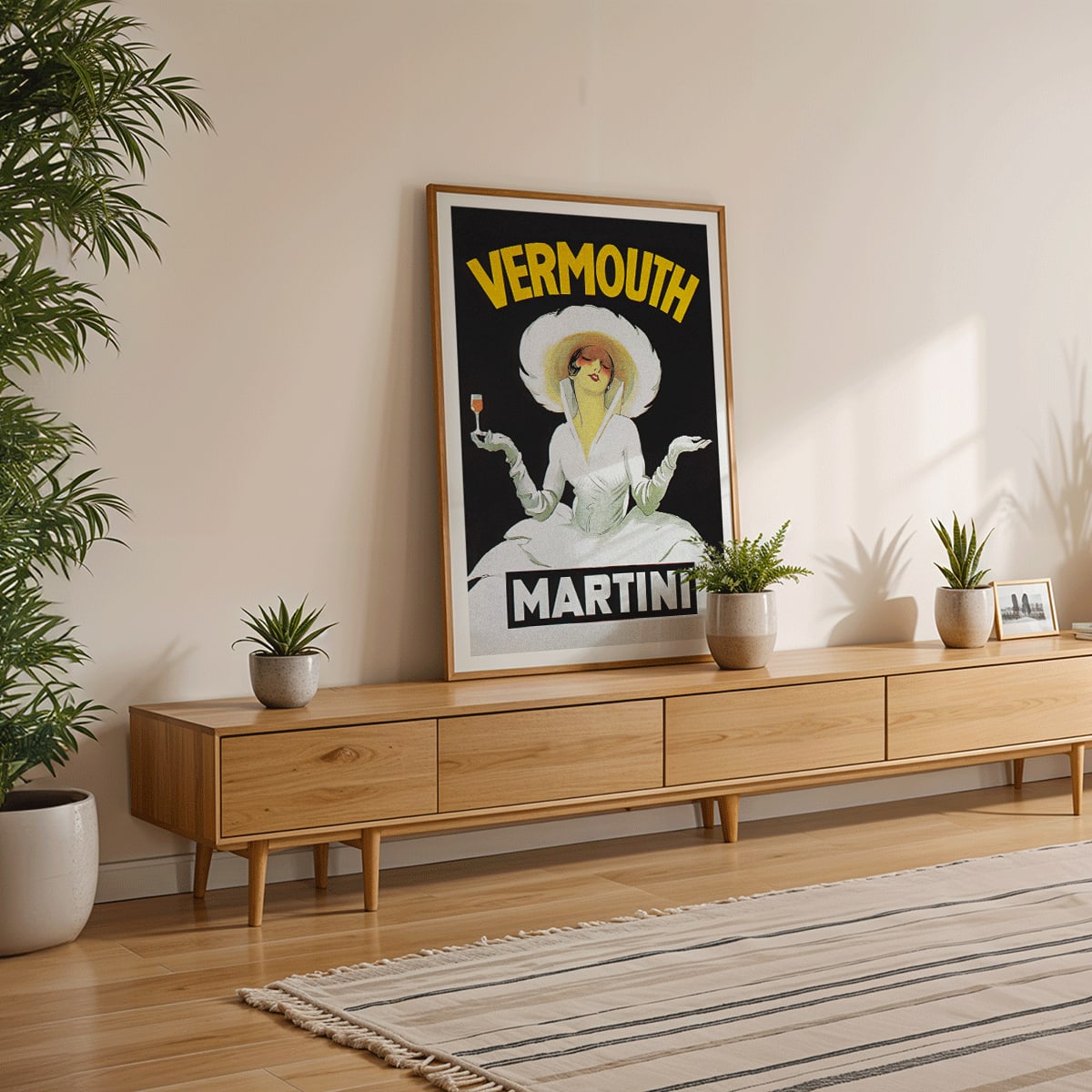 Vermouth Martini by Marcello Dudovich vintage poster art featuring an elegant woman in white holding a glass against a black background, framed and displayed in home decor