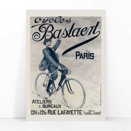 Vintage bicycle poster joyful man riding and waving on Cycles Bastaent Paris bike artwork by Charles Tichon, framed and displayed in modern living room decor