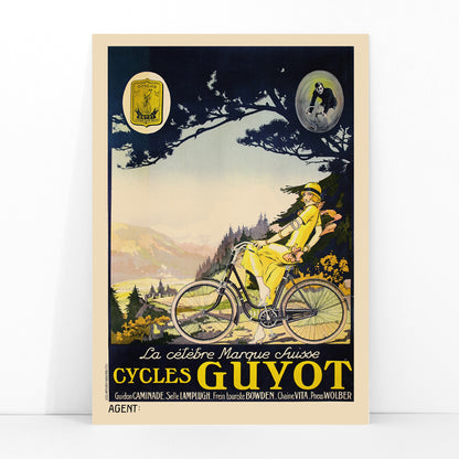 Woman in yellow riding a bicycle through a scenic landscape Cycles Guyot vintage poster artwork, framed and displayed in modern living room decor